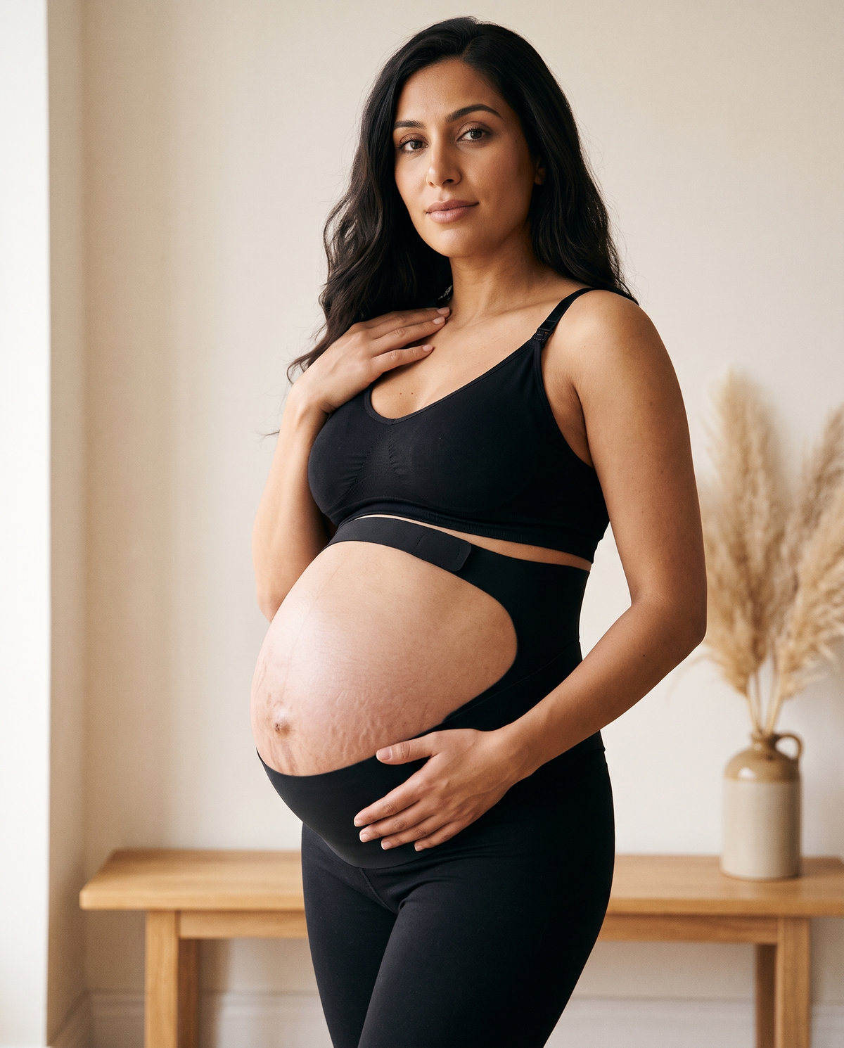 Contour Bump Support in black worn with a black bralette and leggings