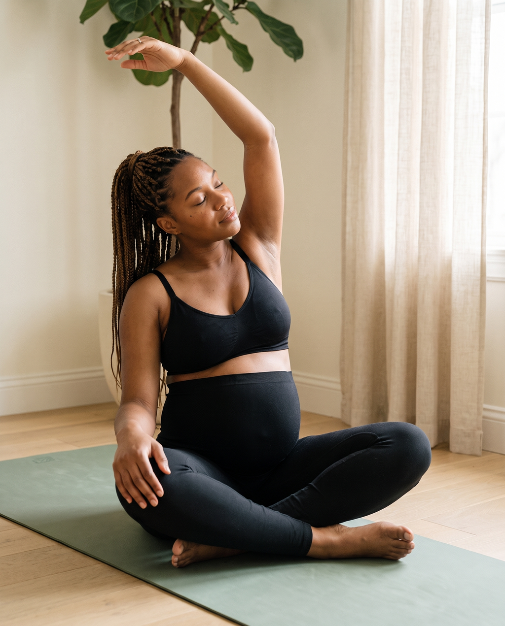 Gentle at-home stretch wearing the black Softline Belly Band